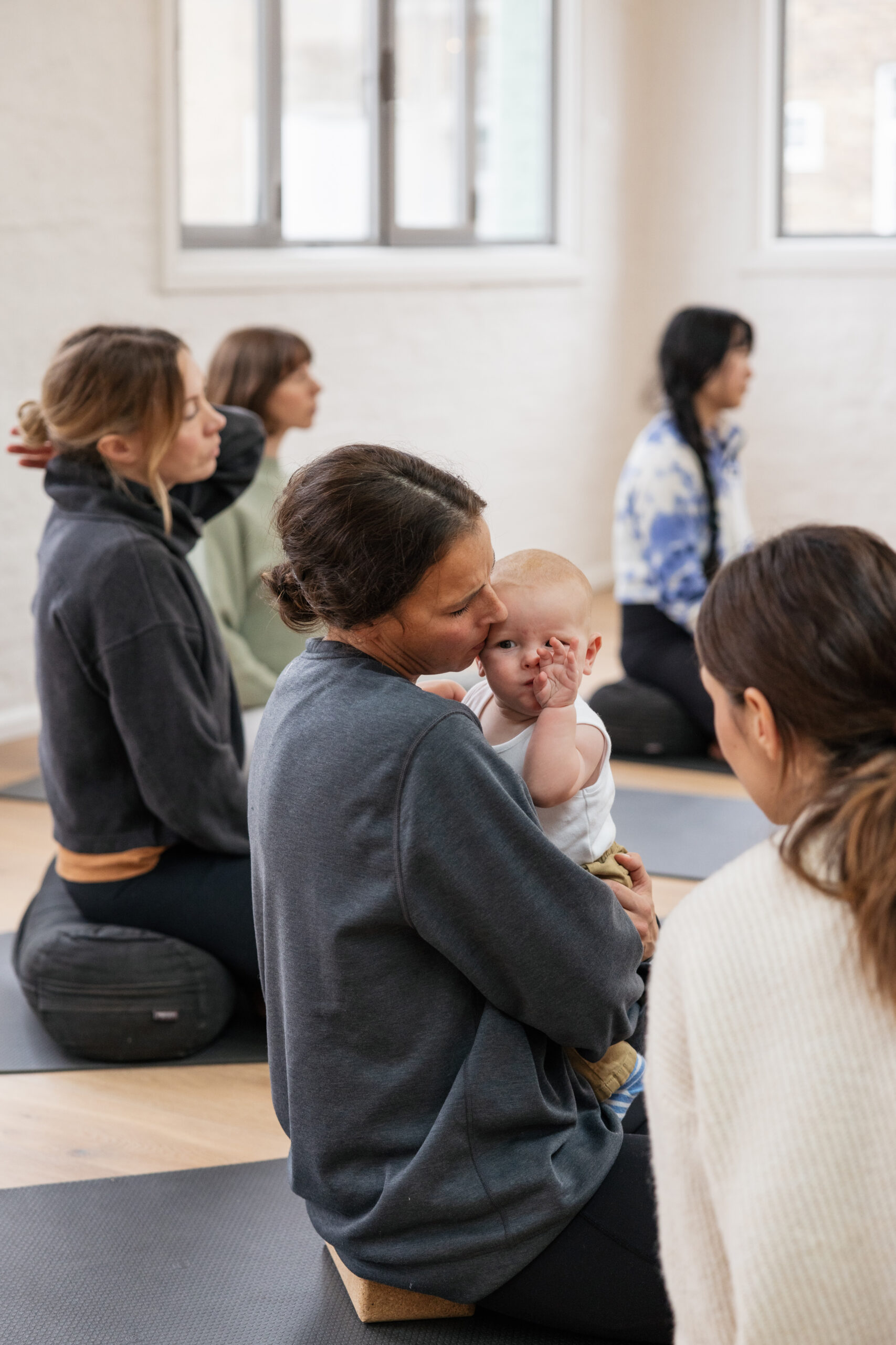 Yoga teacher training as a busy mum — student with her baby on Hana Saotome's BWY course in London
